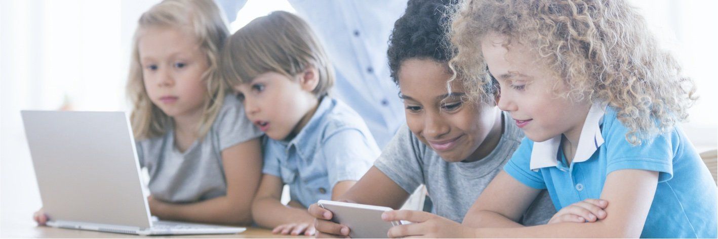 children looking at electronic devices