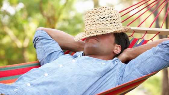 man napping in a hammock