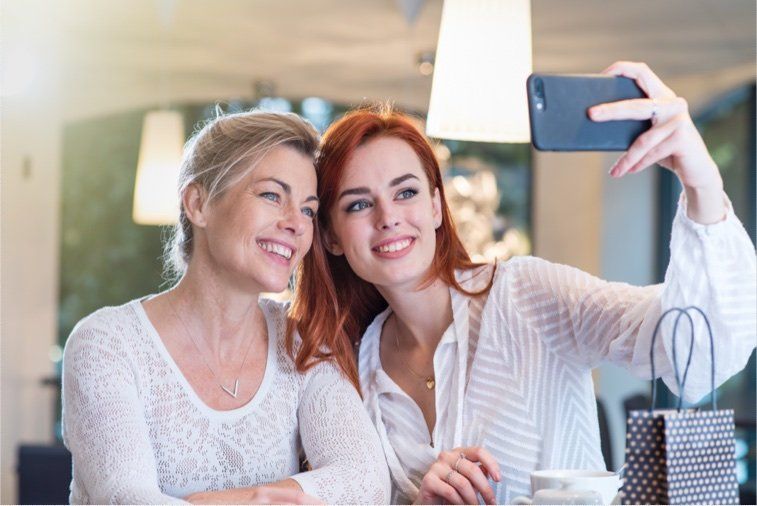 Two women taking self-portrait
