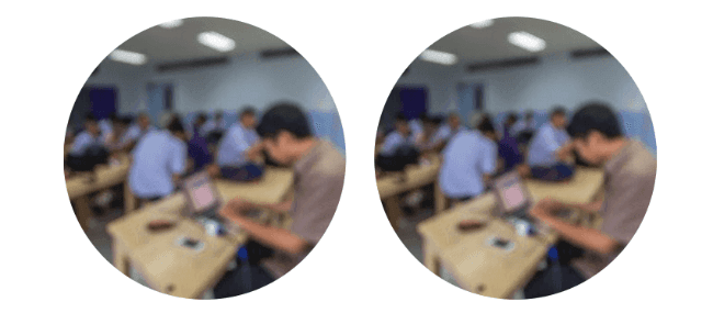 A blurry picture of a group of people in a classroom simulating. myopia