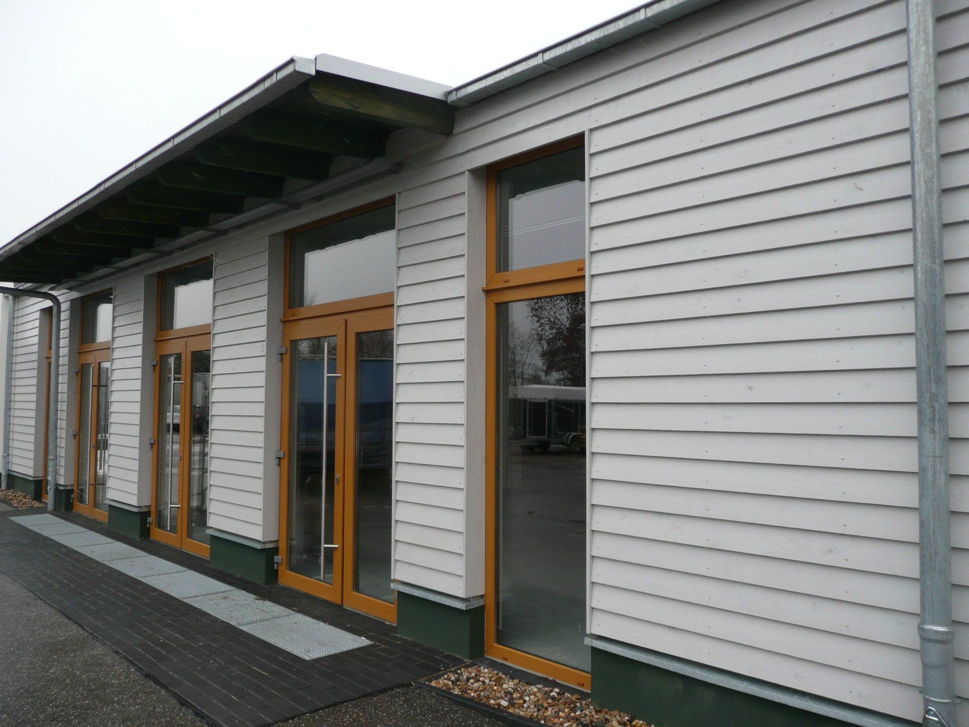 A white building with a lot of windows and doors