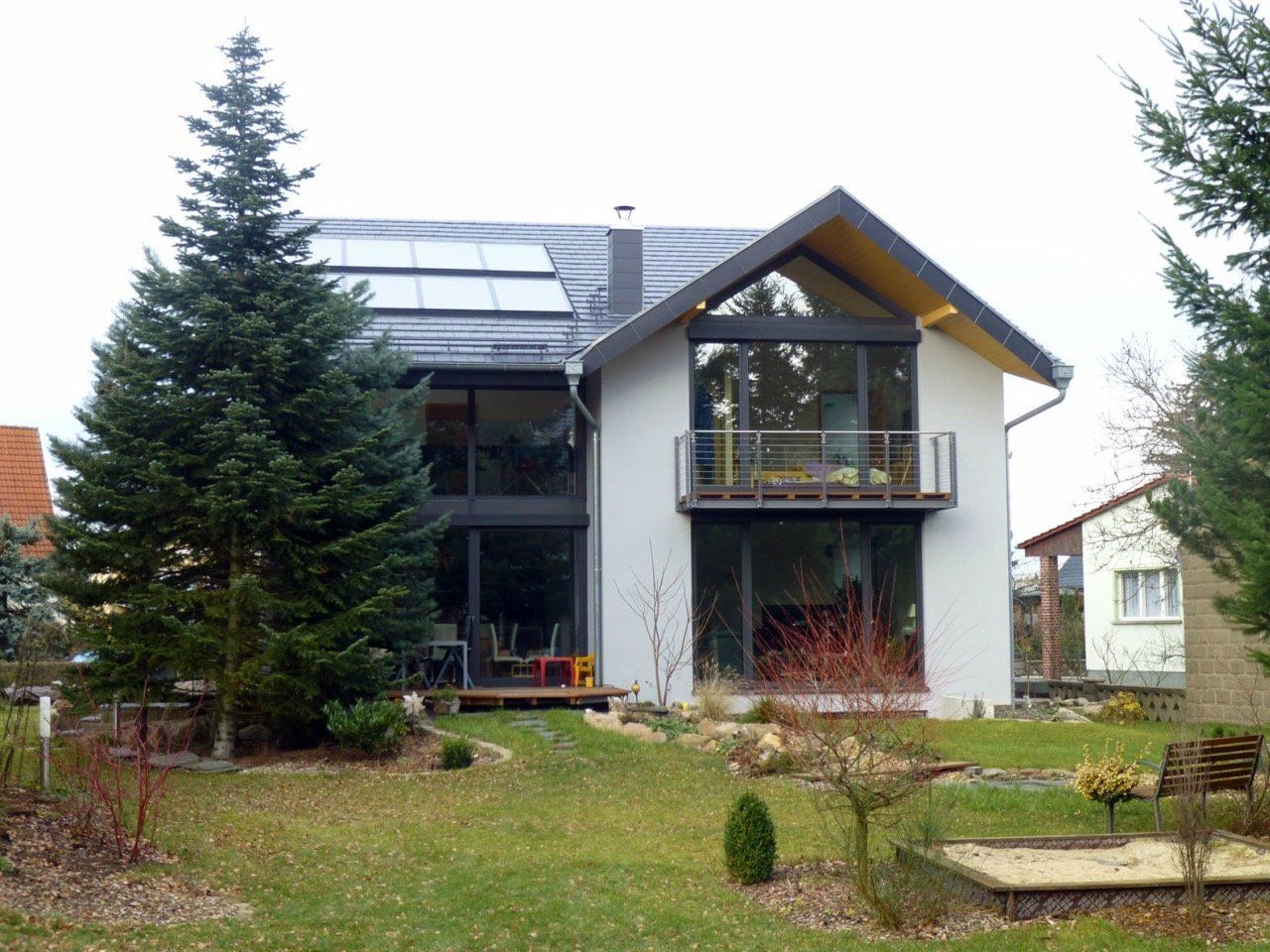A house with a balcony and a lot of windows