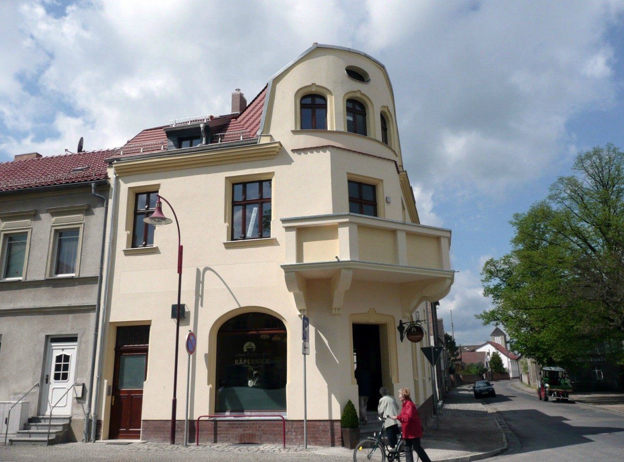 A building with a balcony on the side of it