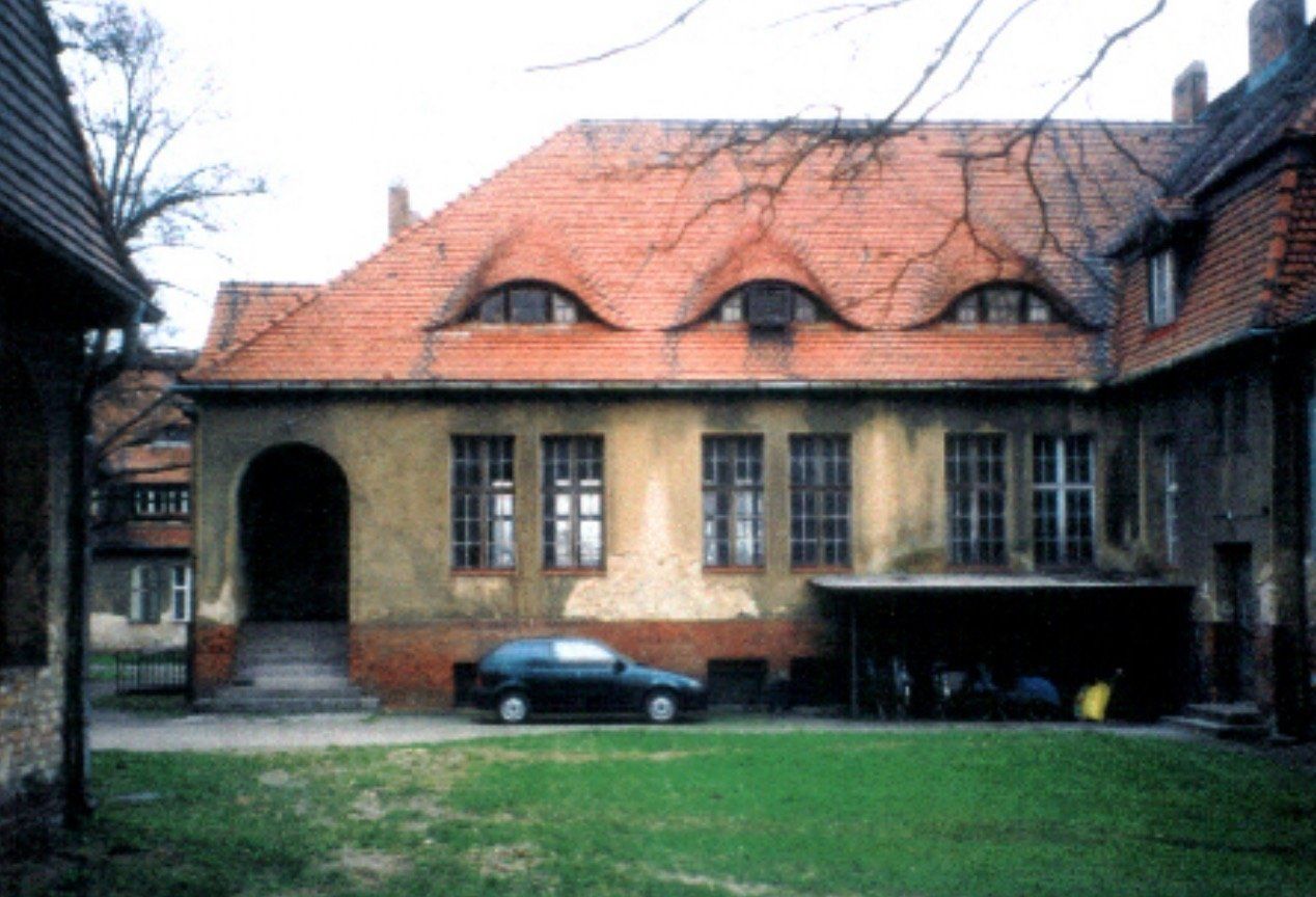 A building with a car parked in front of it