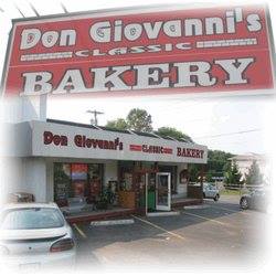 Don Giovanni’s Classic Bakery storefront with large red sign and parked cars outside
