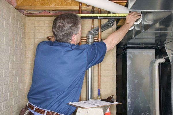 Handyman Inspecting Pipe - Plumbing Installations in San Bernardino, CA Handyman Inspecting Pipe - Plumbing Installations in San Bernardino, CA