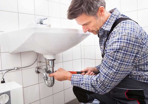 Plumber Fixing Sink Pipe — Manheim, PA — Garden Spot Mechanical, Inc.
