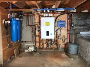 Worker Set Up Electric Heating Boiler — Manheim, PA — Garden Spot Mechanical, Inc. Worker Set Up Electric Heating Boiler — Manheim, PA — Garden Spot Mechanical, Inc.