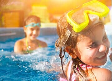 Kids playing at the pool - Swimming Pool Cover & Enclosure Dealers in Mechanicsburg, PA Kids playing at the pool - Swimming Pool Cover & Enclosure Dealers in Mechanicsburg, PA