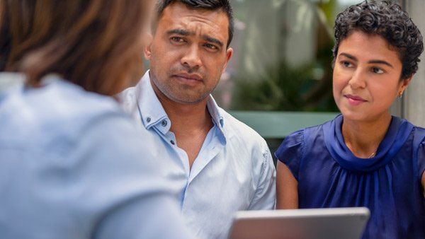 two people talking to lawyer