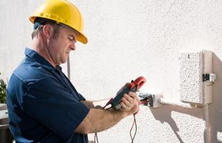Electrical Repair — Man Fixing a Electrical Meter in Mansfield, OH Electrical Repair — Man Fixing a Electrical Meter in Mansfield, OH