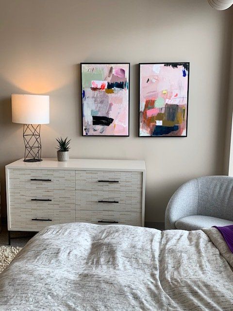 Chris' bedroom featuring an original pair by artist Allison James