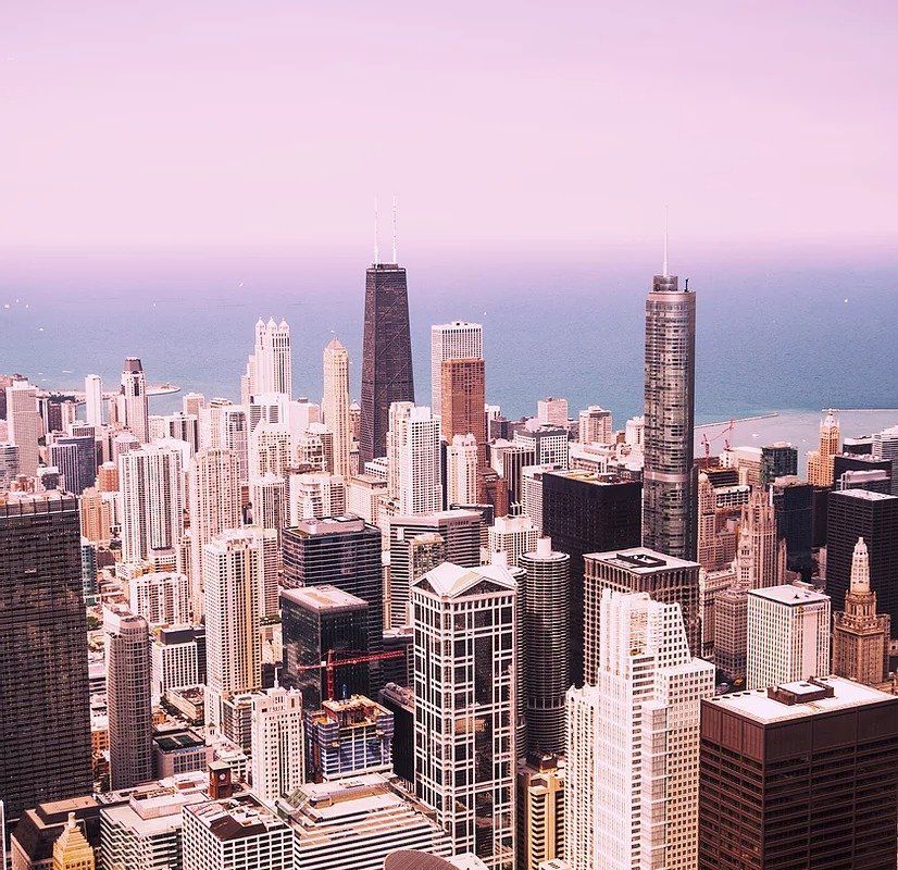 An aerial view of a city with lots of tall buildings