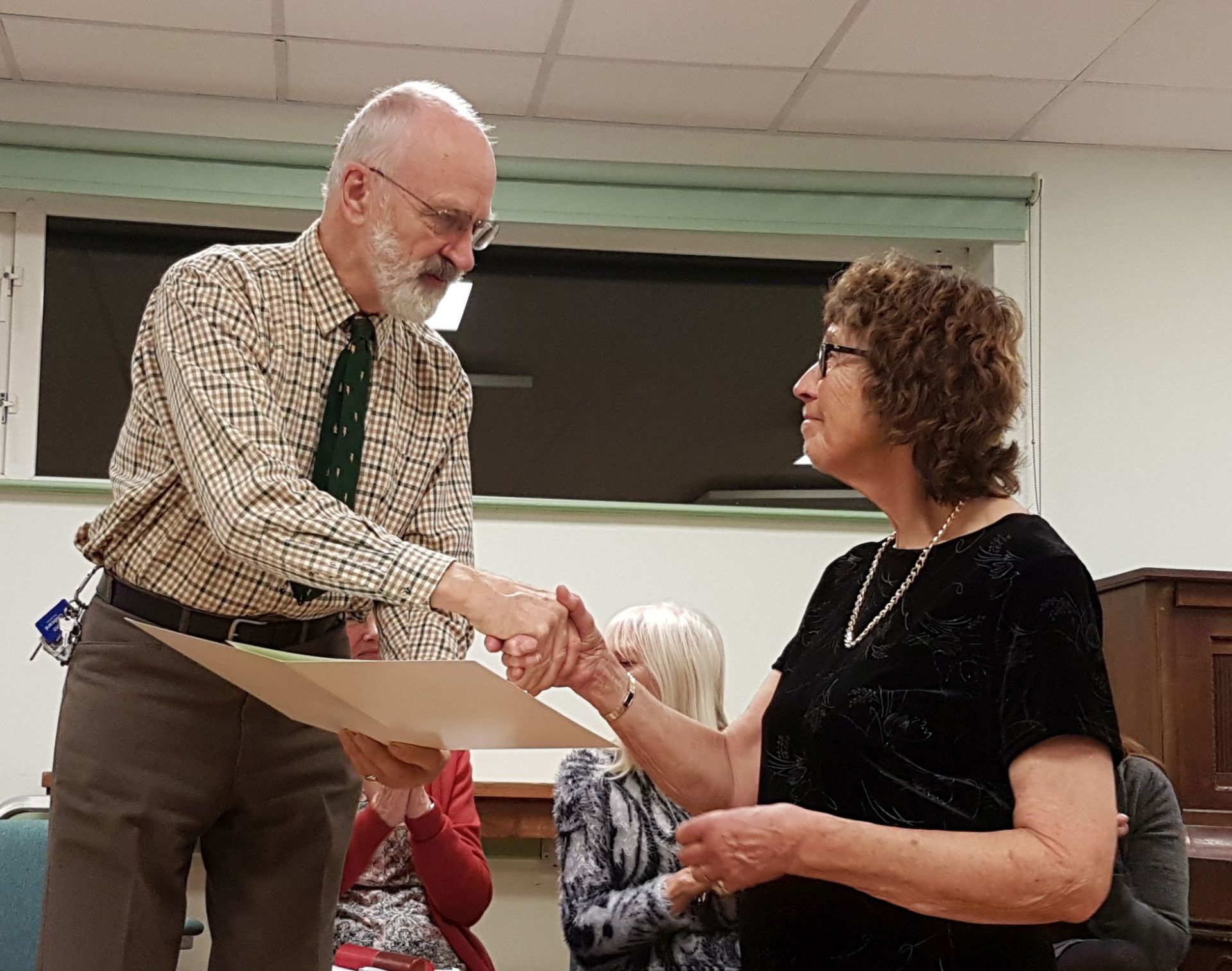 Pat Sutton accepts the Banksian Medal from Edward Richardson