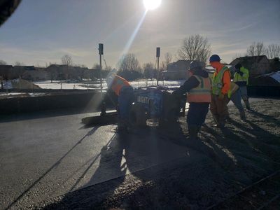 Copperhead Laser Screed — Workers Using Copperhead Laser Screed in Longmont, CO Copperhead Laser Screed — Workers Using Copperhead Laser Screed in Longmont, CO