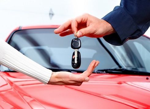 Key being returned to a customer after towing service in Moab, UT
