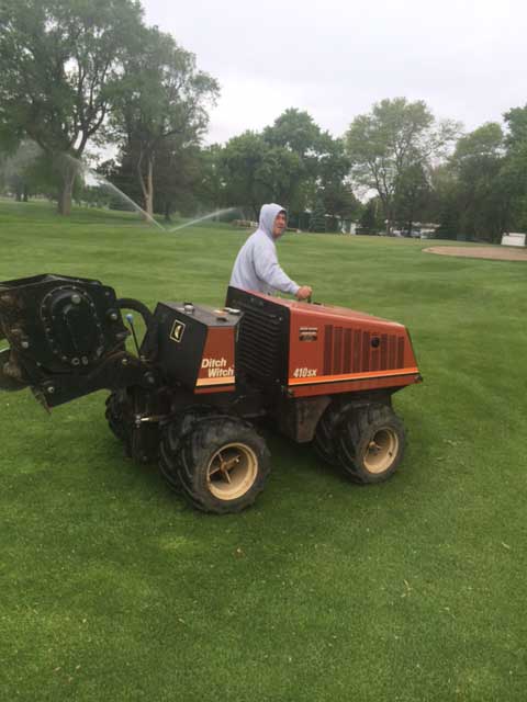 GI-sprinkler-guy-Tim-riding-on-equip