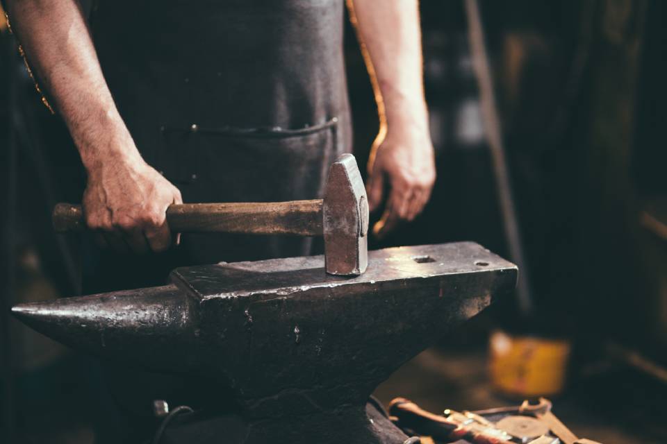 blacksmith with anvil and hammer