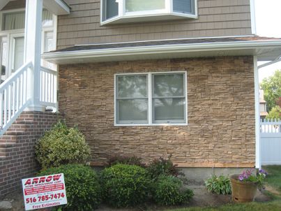 home with vinyl replacement windows - Arrow Home Improvements
