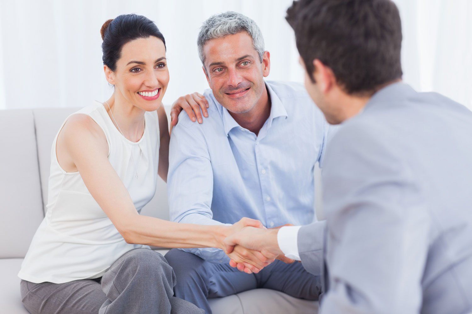 Commercial Real Estate — Couple Shaking Hands with Agent in Richmond, VA Commercial Real Estate — Couple Shaking Hands with Agent in Richmond, VA