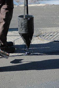 Top Repairs — Man Repairing Road Cracks in Denver, CO Top Repairs — Man Repairing Road Cracks in Denver, CO
