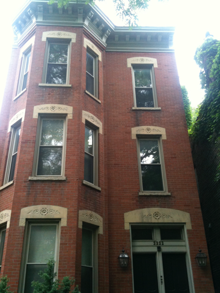 A large red brick building with a lot of windows