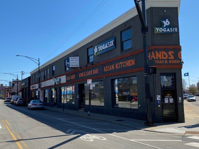 A building with a sign that says yogasix on it