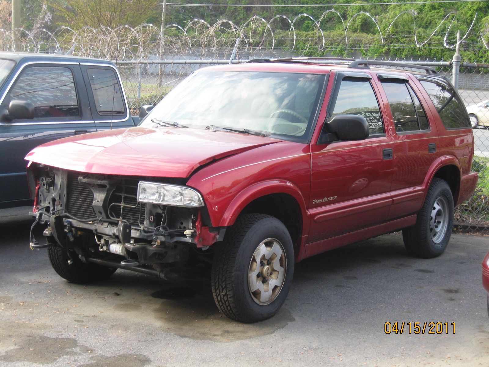 Damaged Red Vehicle in Winston-Salem, NC