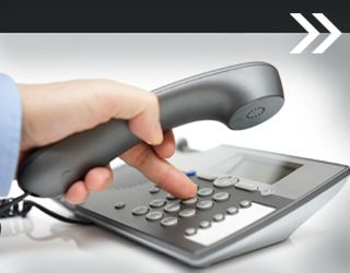 Hand Holding Phone and Dialing Number
