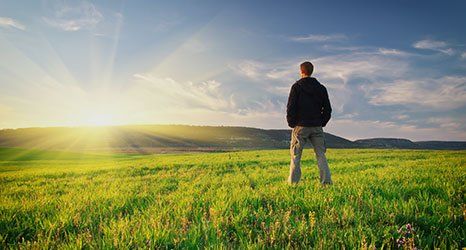 a man looking at sunrise