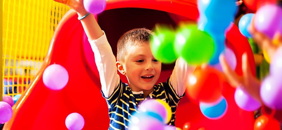 a boy in ball pool