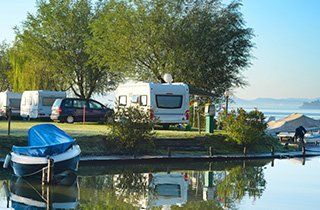 RV parking next to water