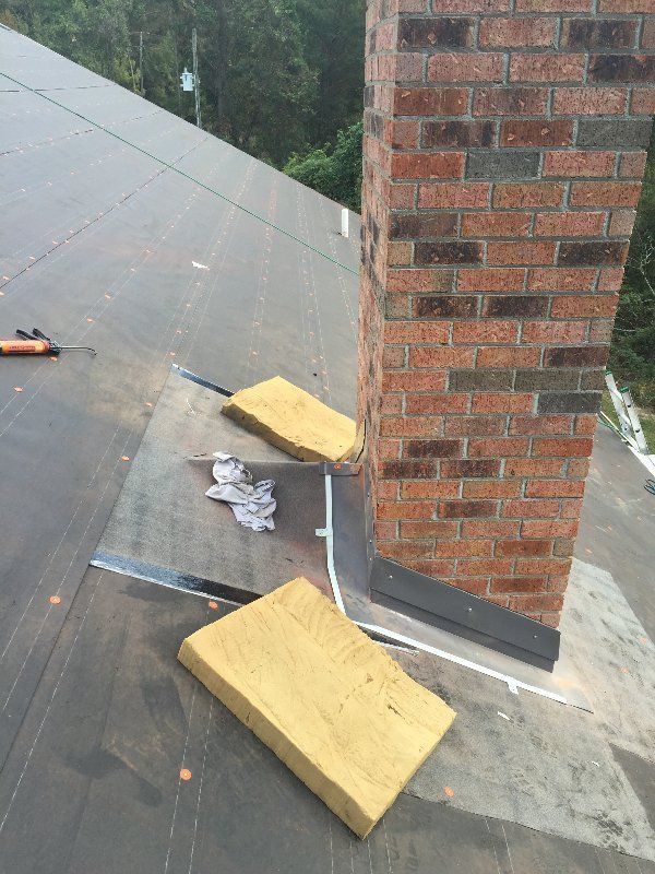 roofing process around a chimney