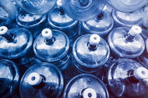 Bottled Water — Closeup On Mineral Water Bottles In Raw And Lines in Sandusky, OH Bottled Water — Closeup On Mineral Water Bottles In Raw And Lines in Sandusky, OH