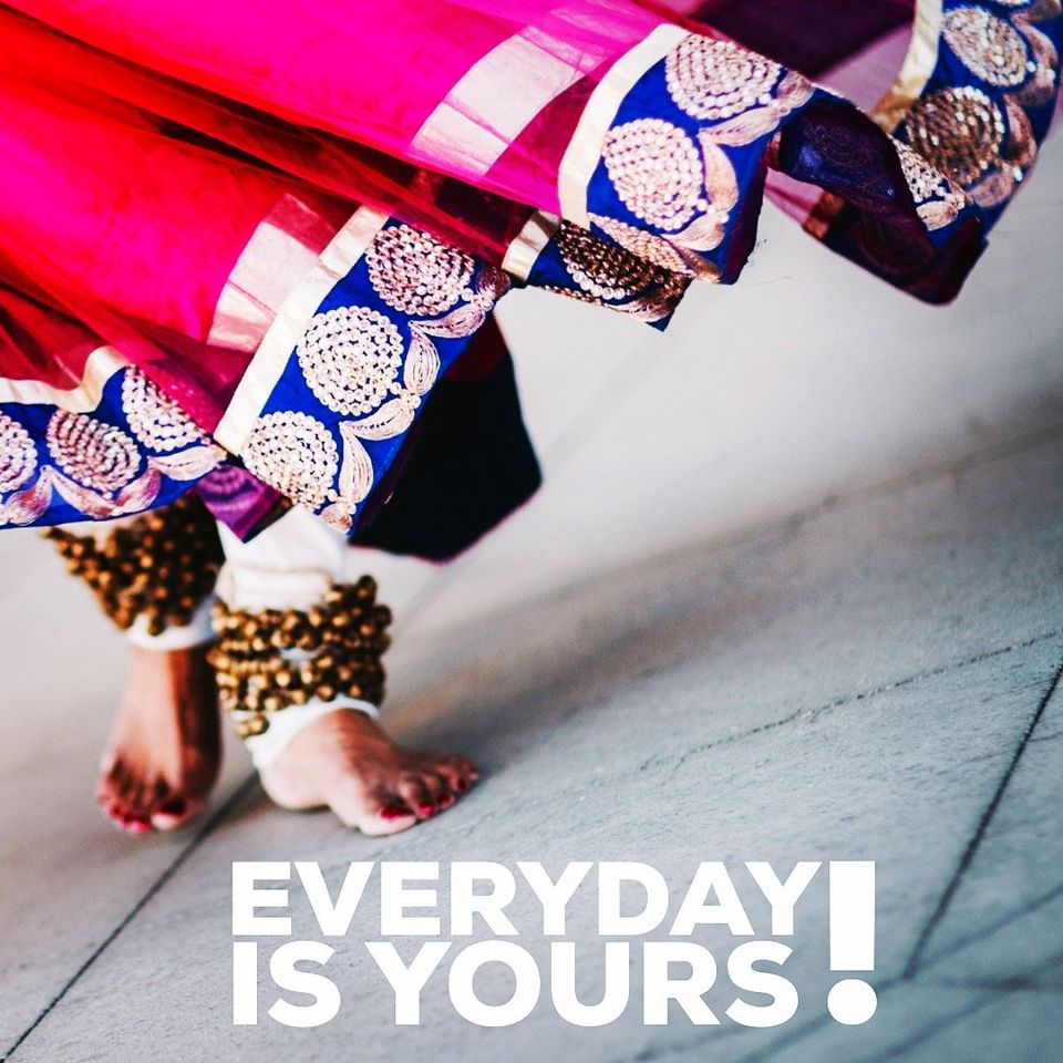 Image of Asian woman, with little bells around her ankles, dancing