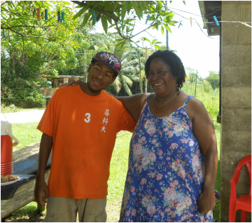 A man wearing an orange shirt with the number 3 on it