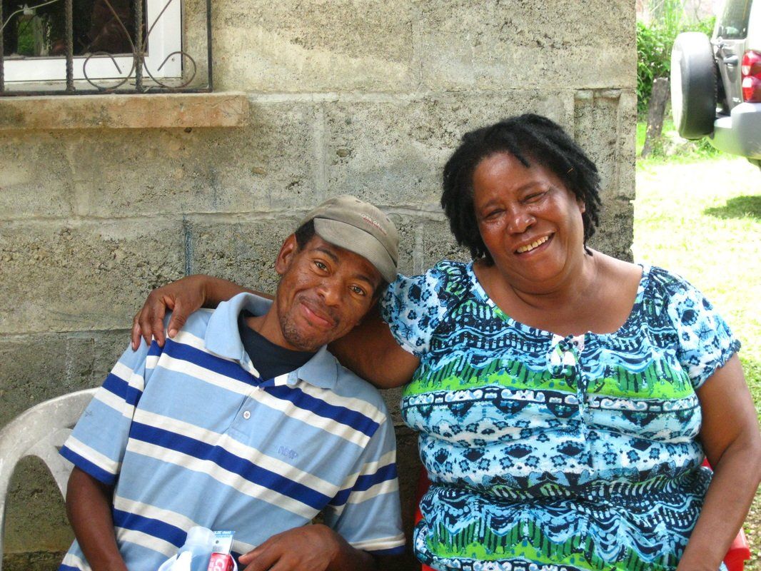 A man and a woman are posing for a picture