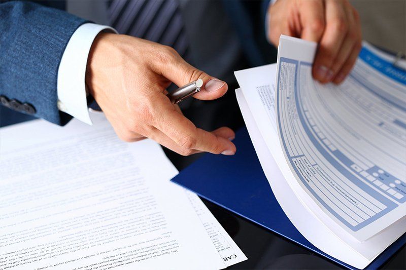 Insurance Markets — Man Checking Business Documents in Stronghurst, IL