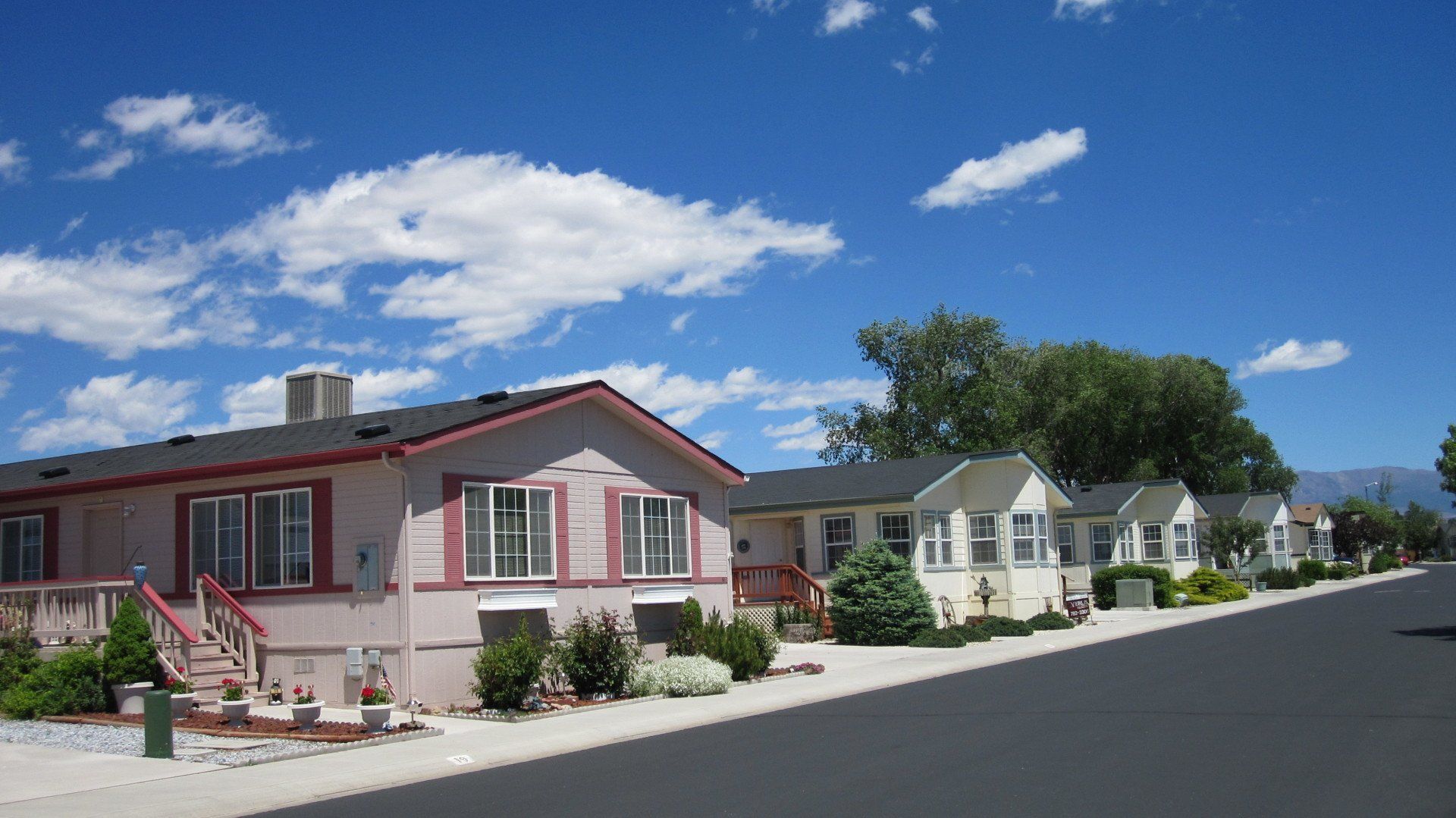 A row of mobile homes on a sunny day