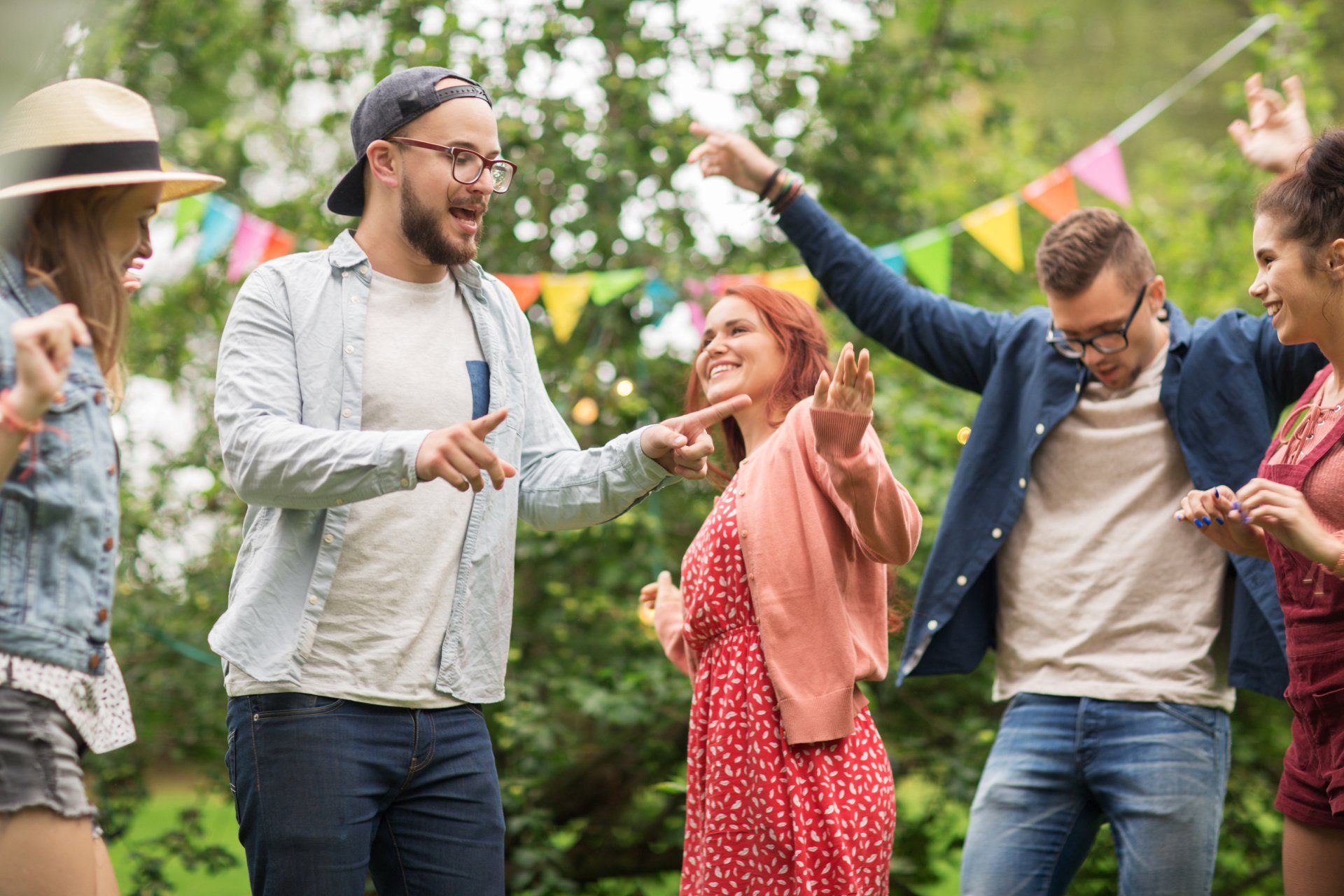 A group of young people are dancing together at a party.