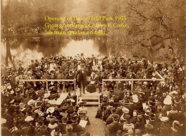 A black and white photo of a crowd of people at a park
