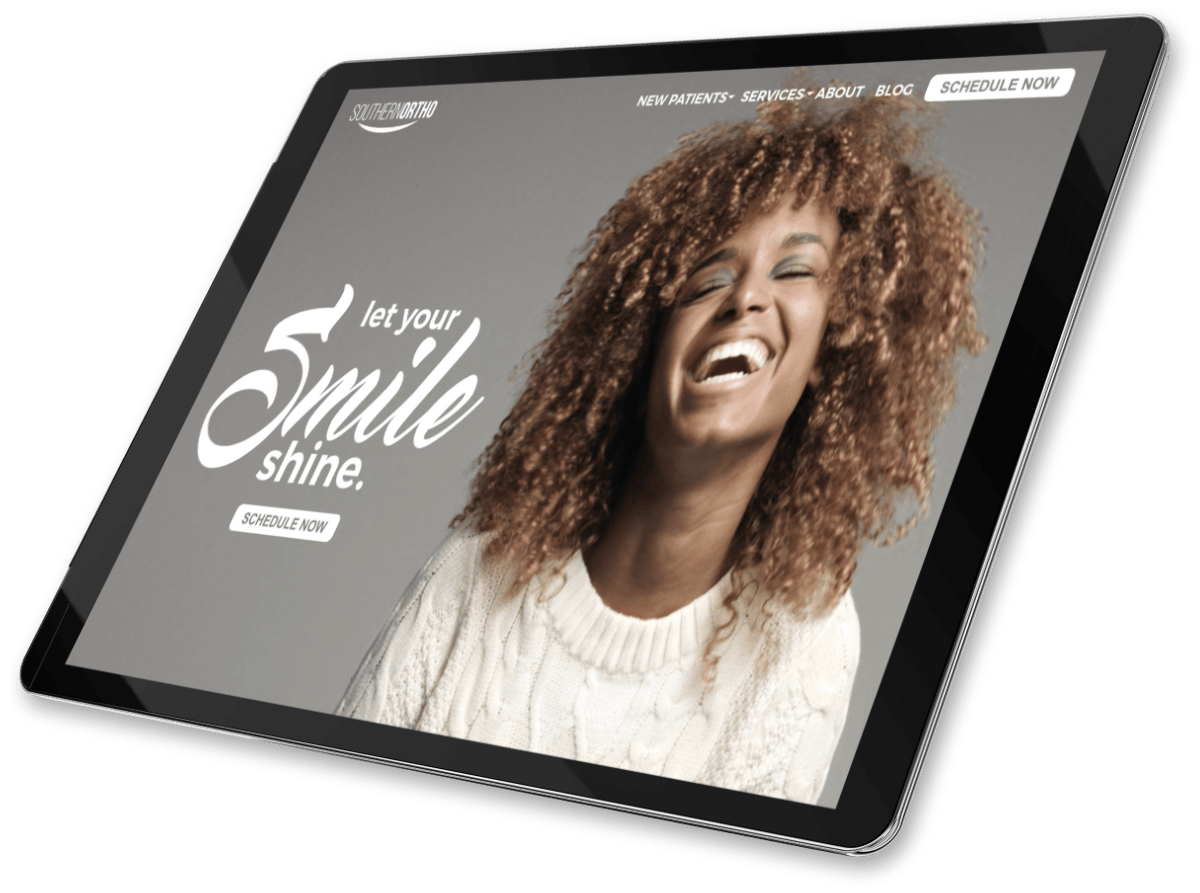 Black brochure with smiling person on the cover and the words “Smile Shine”