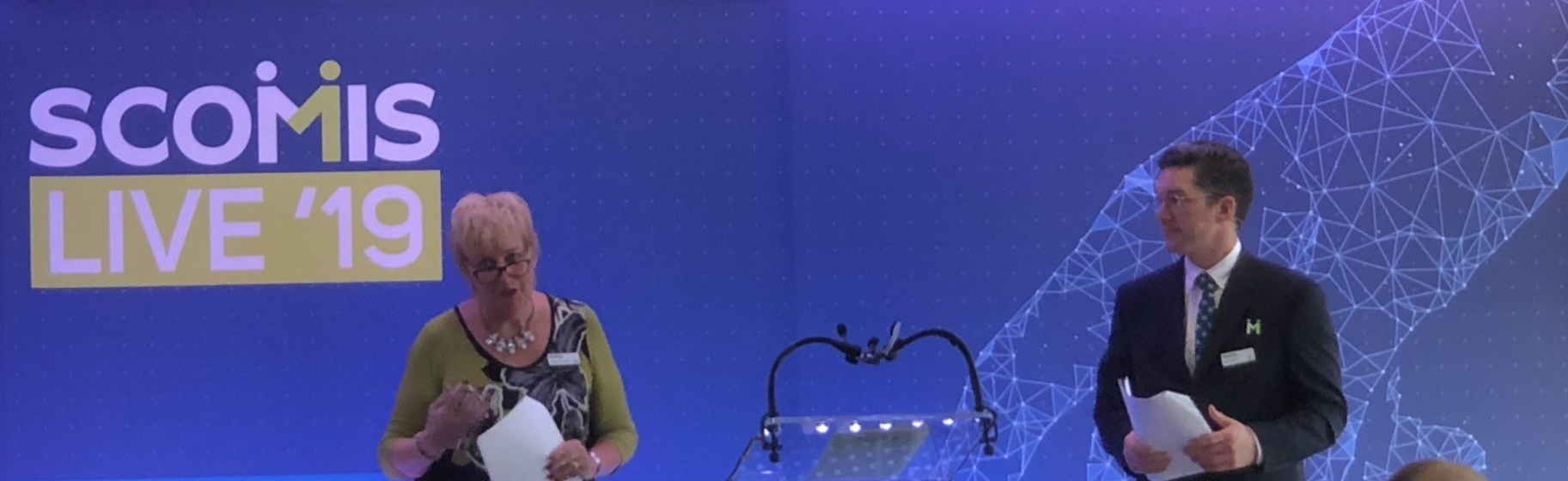 Head of Scomis, Debbie Foweraker and Senior Analyst, Lewis Holt delivering the welcome speech