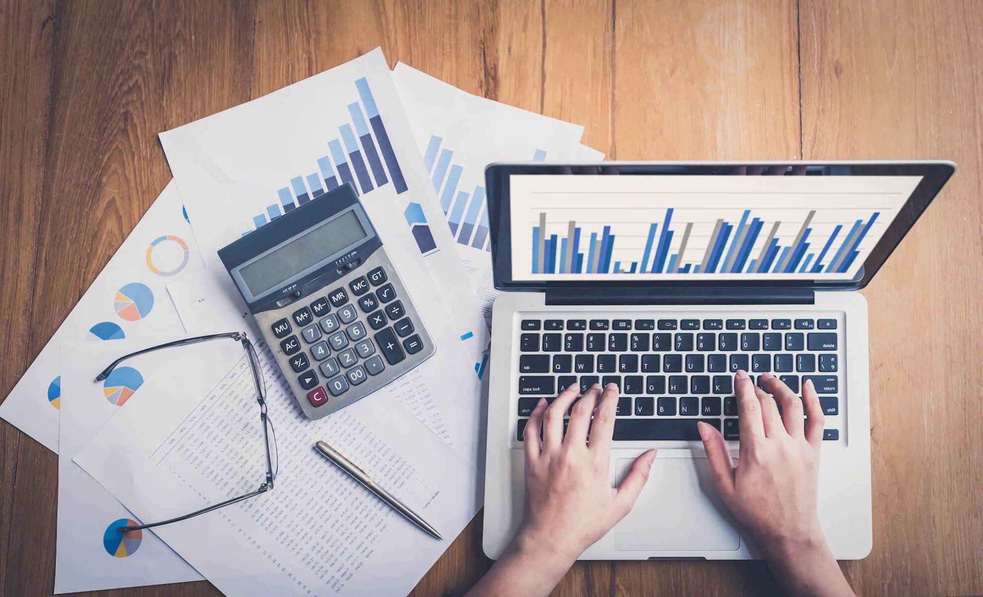 man working with business gadgets on table