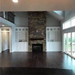High Ceiling Living Room With Tall Fireplace — Rocky Mount, VA — Lozeau Construction Inc
