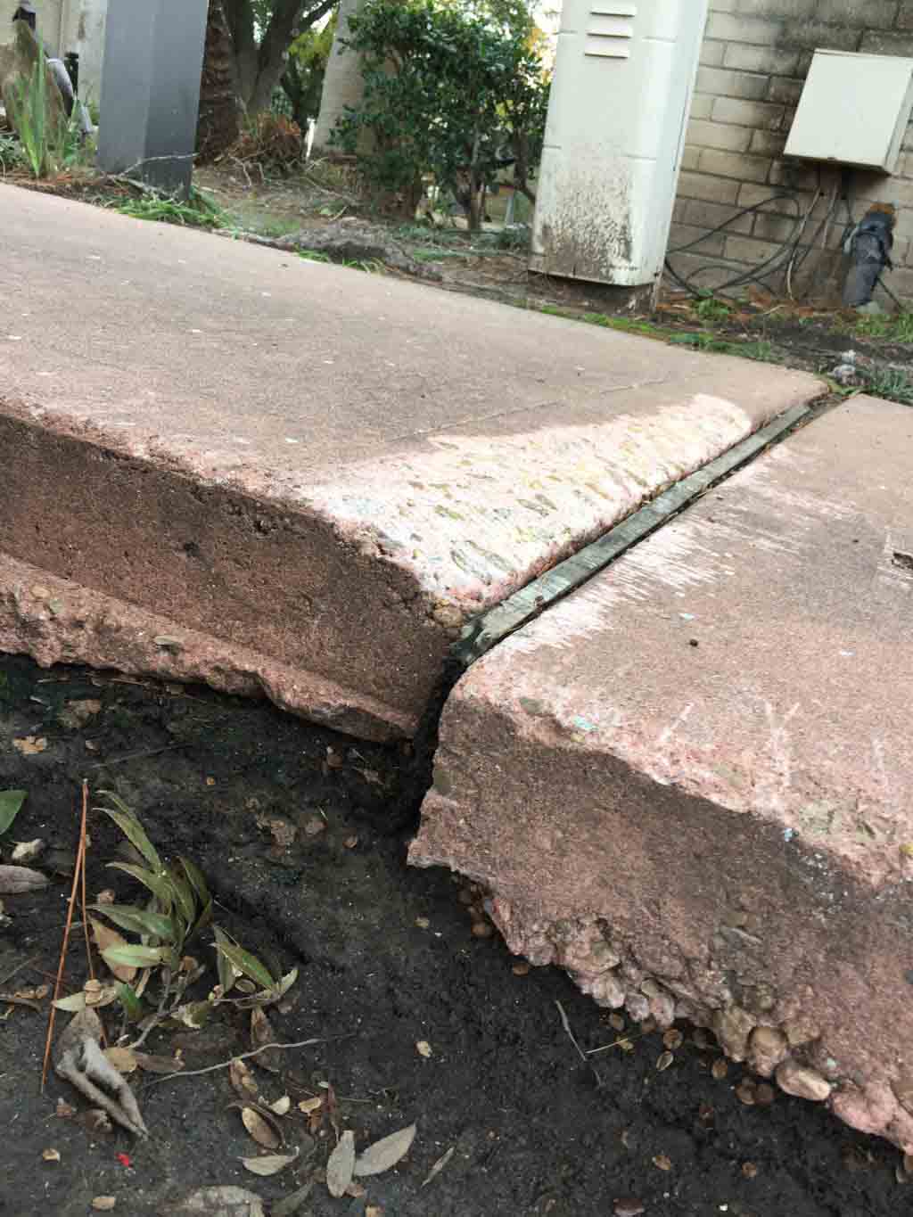 hazardous broken walkway
