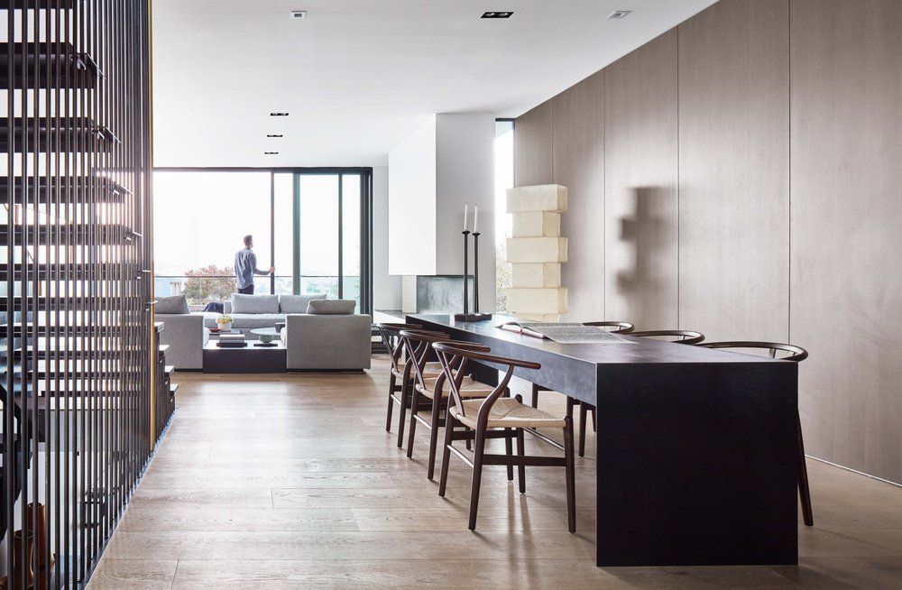 Custom craft cabinets lining walls of a dining room.
