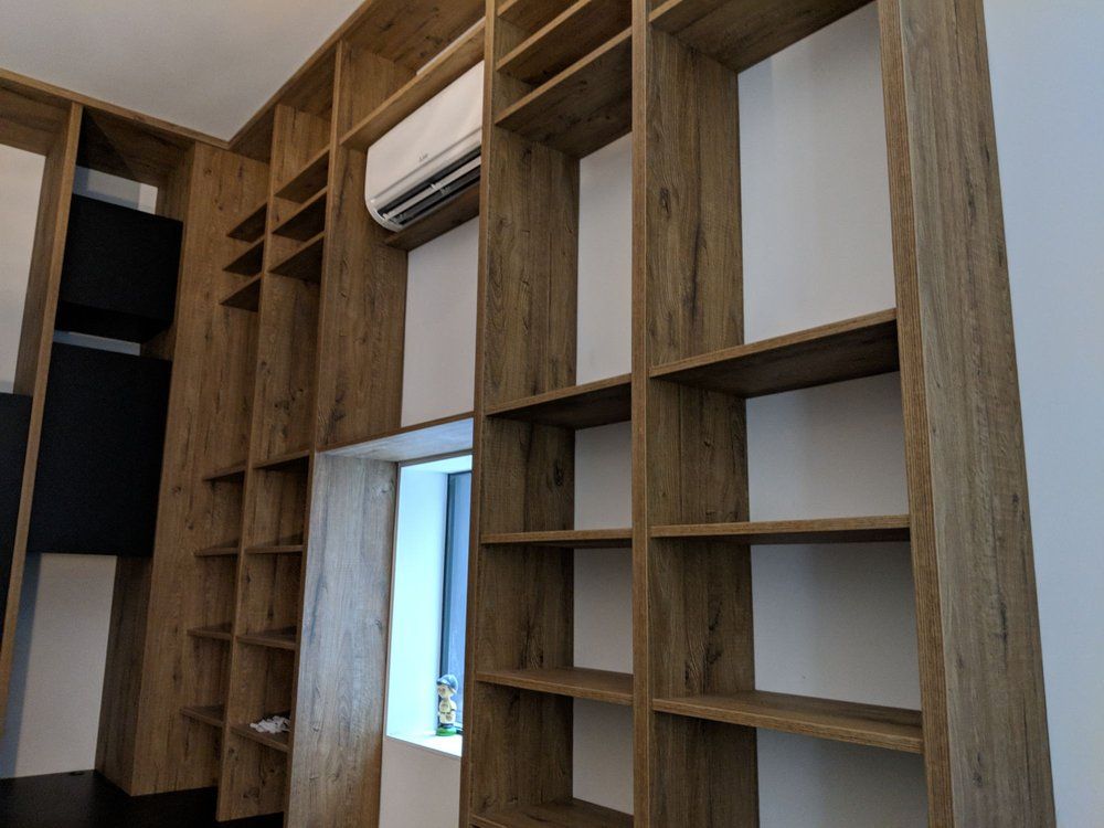 Custom craft cabinets surrounding window in San Francisco, CA home.
