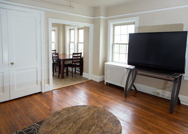 A wide view of the living area with a large flatscreen TV.