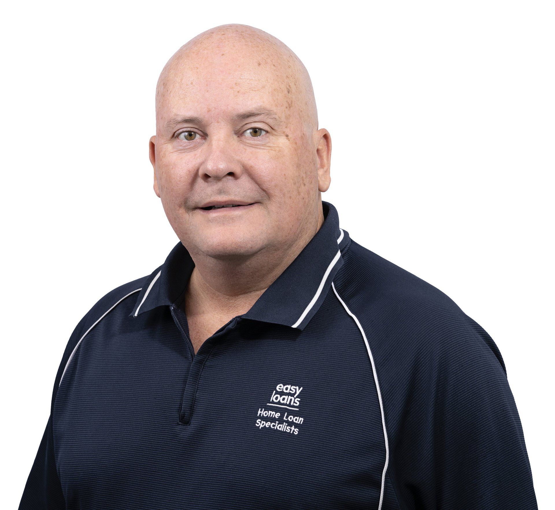 A bald man wearing a blue shirt with a logo on it